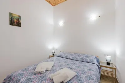 a bedroom with a bed with blue lights on it at Perla Marina in Trappeto