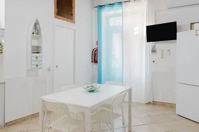 a living room with a couch and a window at Perla Marina in Trappeto