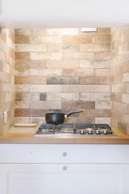 a pot on a stove top in a kitchen at Torre Lanza di Guidaloca By DomuSicily in Castellammare del Golfo