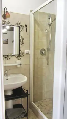 a bathroom with a sink and a shower at Da Sandra in Trabia