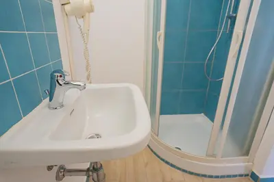 a bathroom with a sink and a shower at Himera Domus 2 in Termini Imerese