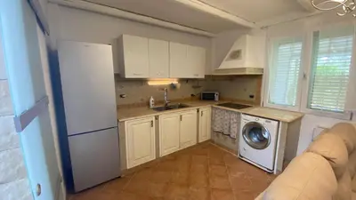 a kitchen with a washer and a washing machine at La Casa Di Maria in Carini