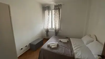 a bedroom with a bed with two towels on it at La Casa Di Maria in Carini