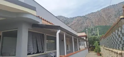 a building with a view of a mountain at La Casa Di Maria in Carini