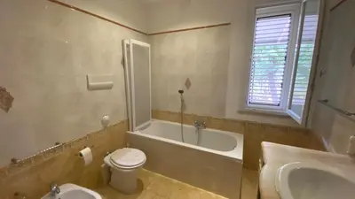 a bathroom with a tub and a toilet and a sink at La Casa Di Maria in Carini