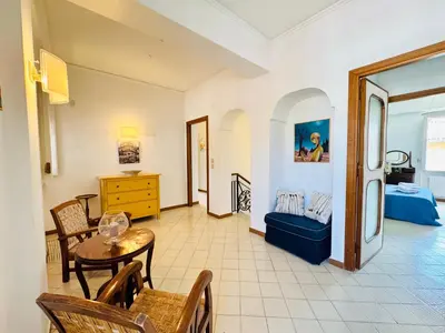 a staircase in a home with a fireplace at Villa Crilulù al Mare in Palermo
