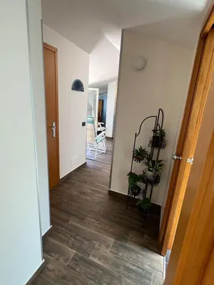 a hallway with potted plants in a room at Fantastic, sea view apartment via Duchessa in Castellammare del Golfo