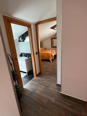 a hallway with a room with a bed and a mirror at Fantastic, sea view apartment via Duchessa in Castellammare del Golfo