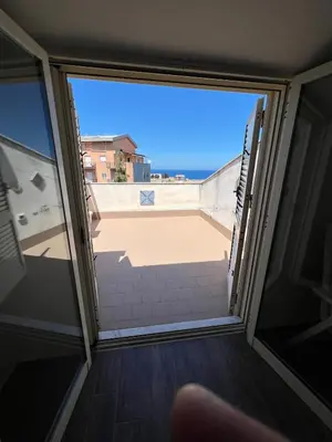 an open door to a balcony with a view at Fantastic, sea view apartment via Duchessa in Castellammare del Golfo