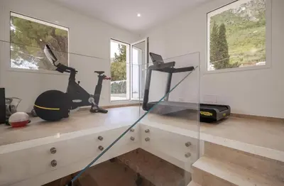 a room with a treadmill and an exercise bike on a counter at Historic Villa Overlooking Scopello Sea Stacks in Castellammare del Golfo