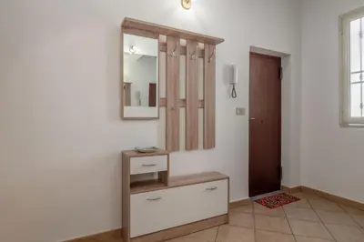 a dressing room with a mirror and a dresser at GuestHost - Don Pippo Flat near Teatro Massimo in Palermo