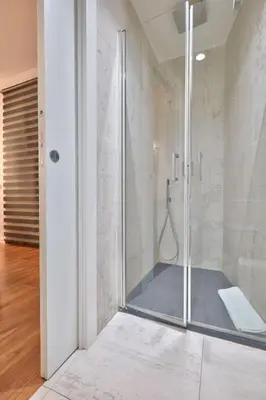 a shower with a glass door in a bathroom at belMORO - La Dimora Del Capo in Palermo