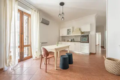 a kitchen with a table and chairs in a room at Gorizia Apartment by Wonderful Italy in Palermo