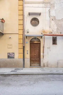 a door on the side of a building at Gorizia Apartment by Wonderful Italy in Palermo