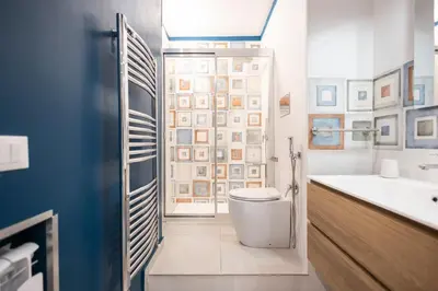 a bathroom with a toilet and a sink at Flat in Center in Palermo