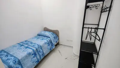 a bed in a room next to a ladder at Roccaforte House - Palermo in Palermo