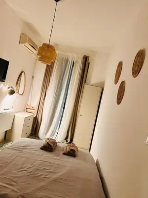 a bedroom with a bed and a window with shoes on it at Porte Rosse in Casteldaccia