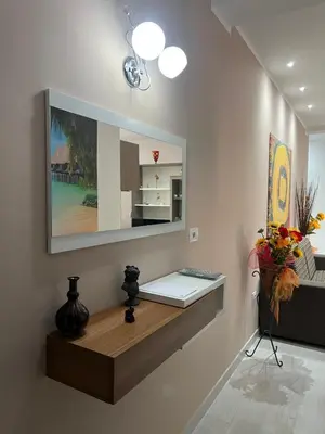 a room with a table with a mirror on the wall at Angela apartments in Partinico