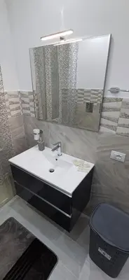 a bathroom with a sink and a toilet at Angela apartments in Partinico