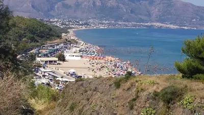 a view of a beach with a crowd of people at MuSa Apartament in Balestrate