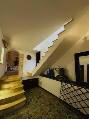 a staircase in a house with a stair case at Dimora Donna Carmela in Capaci