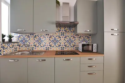 a kitchen with a sink and a microwave at iFlat Papi living in Palermo