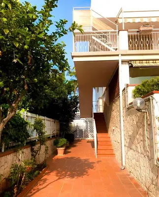 a building with a staircase and a balcony at Oasi Palma - Mondello in Palermo