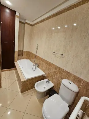 a bathroom with a toilet and a bath tub at Villa Nino in Palermo