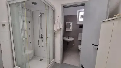 a bathroom with a shower and a sink at Il Loft di Godrano in Godrano