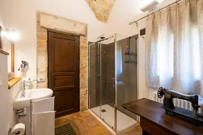 a bathroom with a shower and a sink and a toilet at Villa Cannamele in Carini