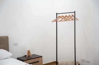 a bedroom with a bed and a lamp on a table at Home1995 in Palermo