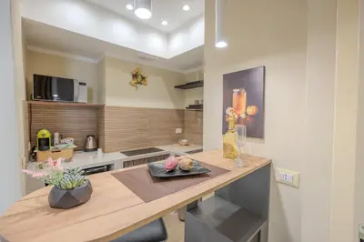 a kitchen with a sink and a counter top at Damas Home in Palermo