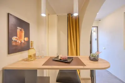 a kitchen with a wooden counter top in a room at Damas Home in Palermo