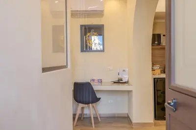 a bedroom with a bed with towels on it at Damas Home in Palermo