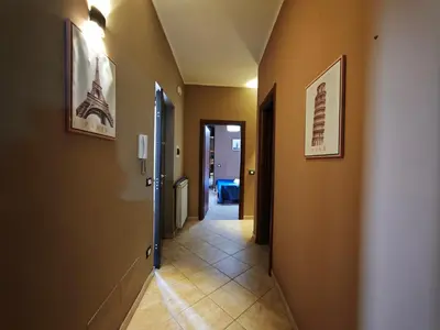 a hallway with a hallway leading into a room with a hallway at Casa Pitrè in Palermo
