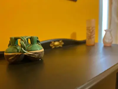 a pair of green shoes sitting on top of a counter at Maria's apartment alla Magione, appartamento in centro in Palermo