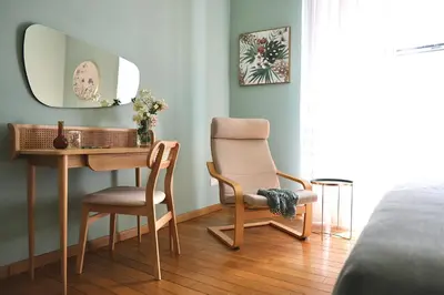 a bedroom with a desk and a chair and a mirror at Maria's apartment alla Magione, appartamento in centro in Palermo