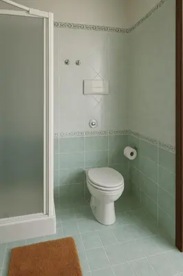 a bathroom with a toilet and a shower at SetteDì Apartment in Palermo