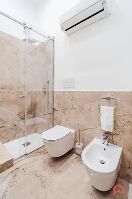 a bathroom with a shower and a toilet and a sink at Nuovissimo Appartamento nel Cuore di Palermo in Palermo