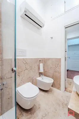 a bathroom with a toilet and a sink at Nuovissimo Appartamento nel Cuore di Palermo in Palermo