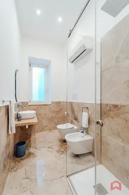 a bathroom with a shower and a toilet and a sink at New Holiday Home in Palermo in Palermo