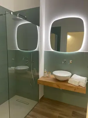 a bathroom with a sink and a mirror at Donna Franca in Cinisi