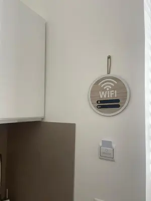 a kitchen with a wifi sign on a wall at Donna Franca in Cinisi
