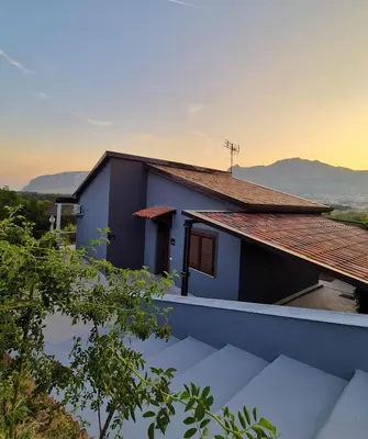 a house with a view of the mountains at Chalet Ponte Paradiso Suite & SPA in Santa Cristina Gela