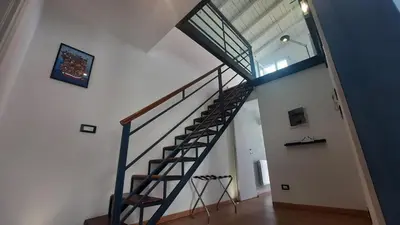 a staircase in a house with a glass ceiling at Oltre i Canti in Palermo