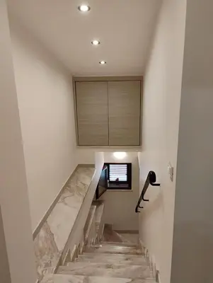 a staircase in a house with a window at Casa dalla Zia Maria in Capaci
