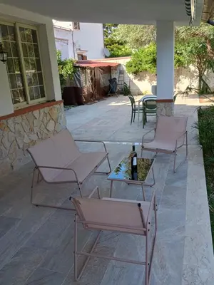 two chairs and a table on a patio at Il Giardino di Lia in Palermo