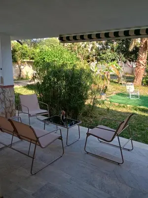 a group of chairs and a table on a patio at Il Giardino di Lia in Palermo