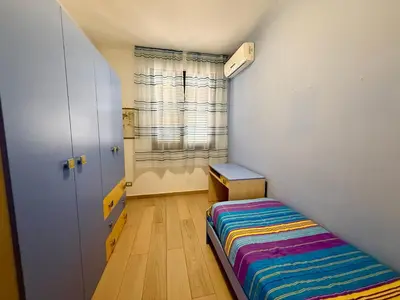 a small room with a bed and a window at Infinity Home in Palermo