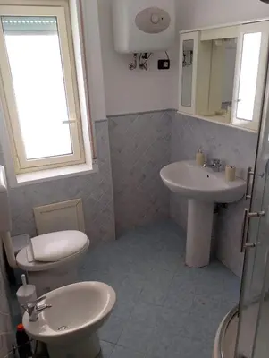 a bathroom with a toilet and a sink at Stella del mare in Palermo